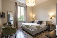A bed or beds in a room at Villa La Tuia B&B