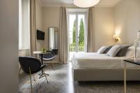 A bed or beds in a room at Villa La Tuia B&B