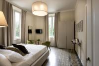 A bed or beds in a room at Villa La Tuia B&B