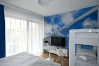 Posteľ alebo postele v izbe v ubytovaní Blue Sky Apartments Rezydencja Niechorze - 302