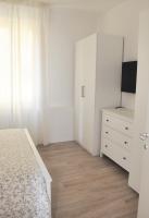 A bed or beds in a room at Verdi appartment