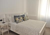 A bed or beds in a room at Verdi appartment