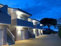 a building with blue and white lights on it at Balconi Del Conero in Numana