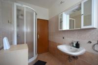a bathroom with a sink and a shower at Apartment Lorela in Malinska