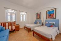 Postel nebo postele na pokoji v ubytování VESTA - El Gouna Residence