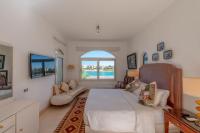 Postel nebo postele na pokoji v ubytování VESTA - El Gouna Residence