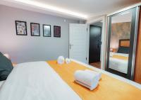 A bed or beds in a room at Umut Apartments