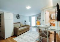 A television and/or entertainment centre at Umut Apartments