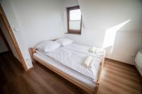 Posteľ alebo postele v izbe v ubytovaní Prowincja Tatra Cottages