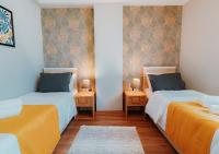 A bed or beds in a room at Umut Apartments