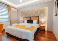 A bed or beds in a room at Umut Apartments