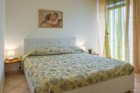 A bed or beds in a room at Sunset Alghero