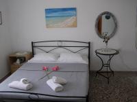 A bed or beds in a room at AGERI STUDIOS
