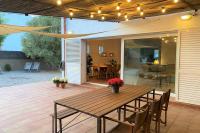 A patio or other outdoor area at LLEBEIG -Casa mediterránea con gran jardín