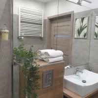 Kúpeľňa v ubytovaní Q Apart AMBER - klimatyzowane STUDIO przy Manufakturze z garażem Gratis, FV