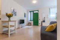 Televízia a/alebo spoločenská miestnosť v ubytovaní The Green Door - Ospedale Maggiore Studio