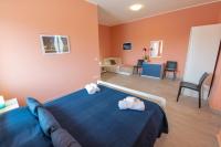 A bed or beds in a room at "Il Segreto" Vista Panoramica sulle Isole Eolie con Piscina, palestra e WiFi