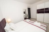 Postel nebo postele na pokoji v ubytování Aelia Apartments