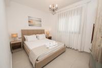 Postel nebo postele na pokoji v ubytování Aelia Apartments
