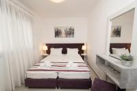 Postel nebo postele na pokoji v ubytování Aelia Apartments