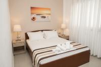 Postel nebo postele na pokoji v ubytování Aelia Apartments