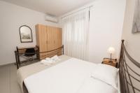 Postel nebo postele na pokoji v ubytování Aelia Apartments