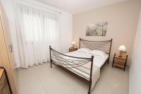 Postel nebo postele na pokoji v ubytování Aelia Apartments