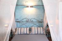 Posteľ alebo postele v izbe v ubytovaní Agriturismo Suite del Conte