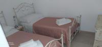 A bed or beds in a room at La Nuova Casetta