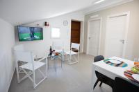 A television and/or entertainment centre at Splendida Villa NATURE- APPARTAMENTO ARANCIO a Scopello - Zingaro