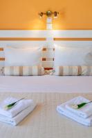 Łóżko lub łóżka w pokoju w obiekcie Stella Hotel