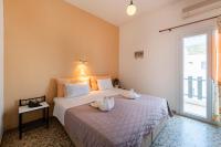 Łóżko lub łóżka w pokoju w obiekcie Stella Hotel
