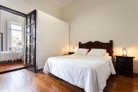 Postel nebo postele na pokoji v ubytování Santa Ana Suite & Rooms