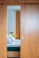 Łóżko lub łóżka w pokoju w obiekcie Apartamenty Starówka