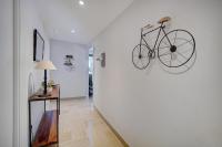 a bike hanging on a wall in a hallway at IMMOGROOM - Close beaches - Terrace with sea view - pool -AC in Cannes