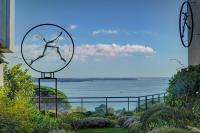 a sculpture of a person in a glass sphere in a garden at IMMOGROOM - Close beaches - Terrace with sea view - pool -AC in Cannes