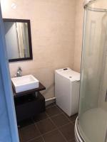a bathroom with a sink and a toilet and a shower at Confort d’Ange in Vaulx-en-Velin
