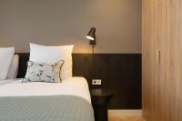 Een bed of bedden in een kamer bij BizStay Maurits