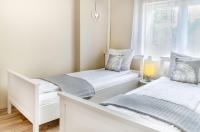 Posteľ alebo postele v izbe v ubytovaní Vintage apartman