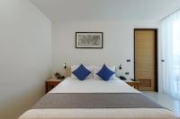Postel nebo postele na pokoji v ubytování Splash Beach Resort, Maikhao Phuket - SHA Extra Plus