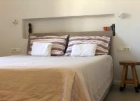 A bed or beds in a room at Thera Incognita Studios