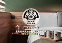 a bedroom with a bed with a sign on it at Muzik Hotel - Ximen Station Branch in Taipei