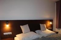 Posteľ alebo postele v izbe v ubytovaní Czermann Holiday Inn