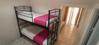 Postel nebo postele na pokoji v ubytování Villa Perkemes Apartments Parga