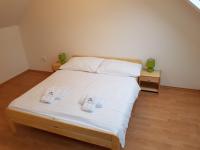 A bed or beds in a room at Dom Via Jasná Demänová