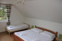 A bed or beds in a room at Dom Via Jasná Demänová