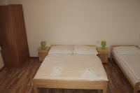 A bed or beds in a room at Dom Via Jasná Demänová