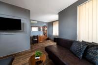 A television and/or entertainment centre at Petrov Family Hotel