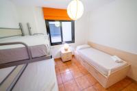 A bed or beds in a room at HomeHolidaysRentals Adara