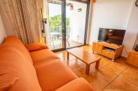 A seating area at HomeHolidaysRentals Adara
